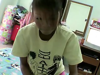 Thai woman in her apartment with milky boyfriend